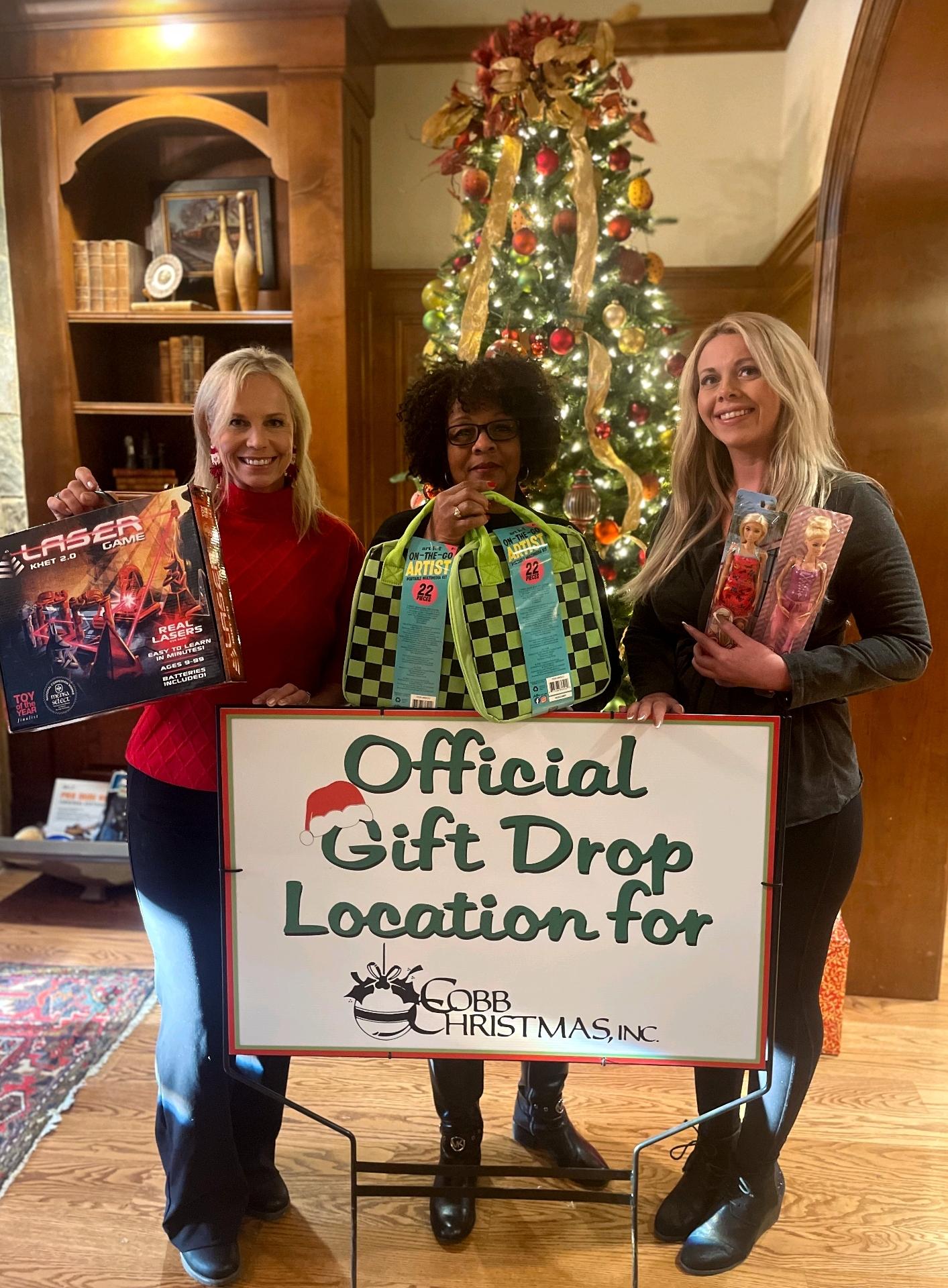 Traton Homes employees at official Cobb Christmas gift drop off location