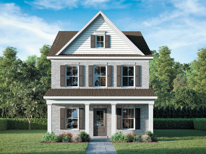 A two-story house with gray brick, white siding, gray shutters, and a covered front porch, surrounded by green lawn, bushes, and trees under a blue sky.