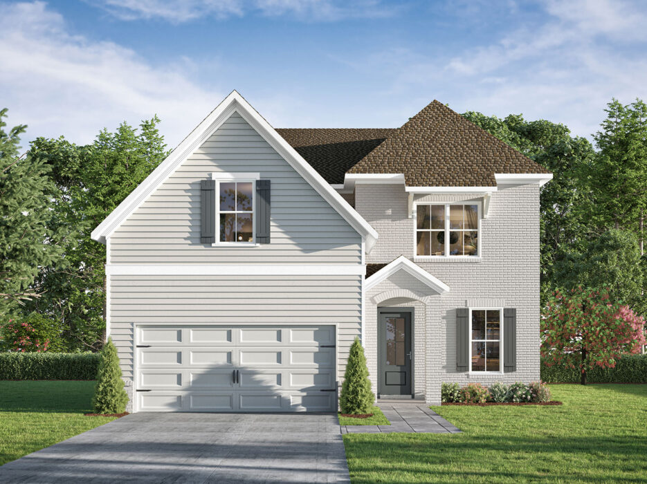 Two-story suburban house with gray siding and brick, double garage, white trim, large windows, and small shrubs along the front walkway. The house sits on a green lawn with trees in the background.